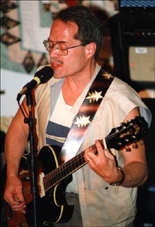 Jeff Alfaro performing on guitar.
